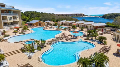 a view of a swimming pool with outdoor seating