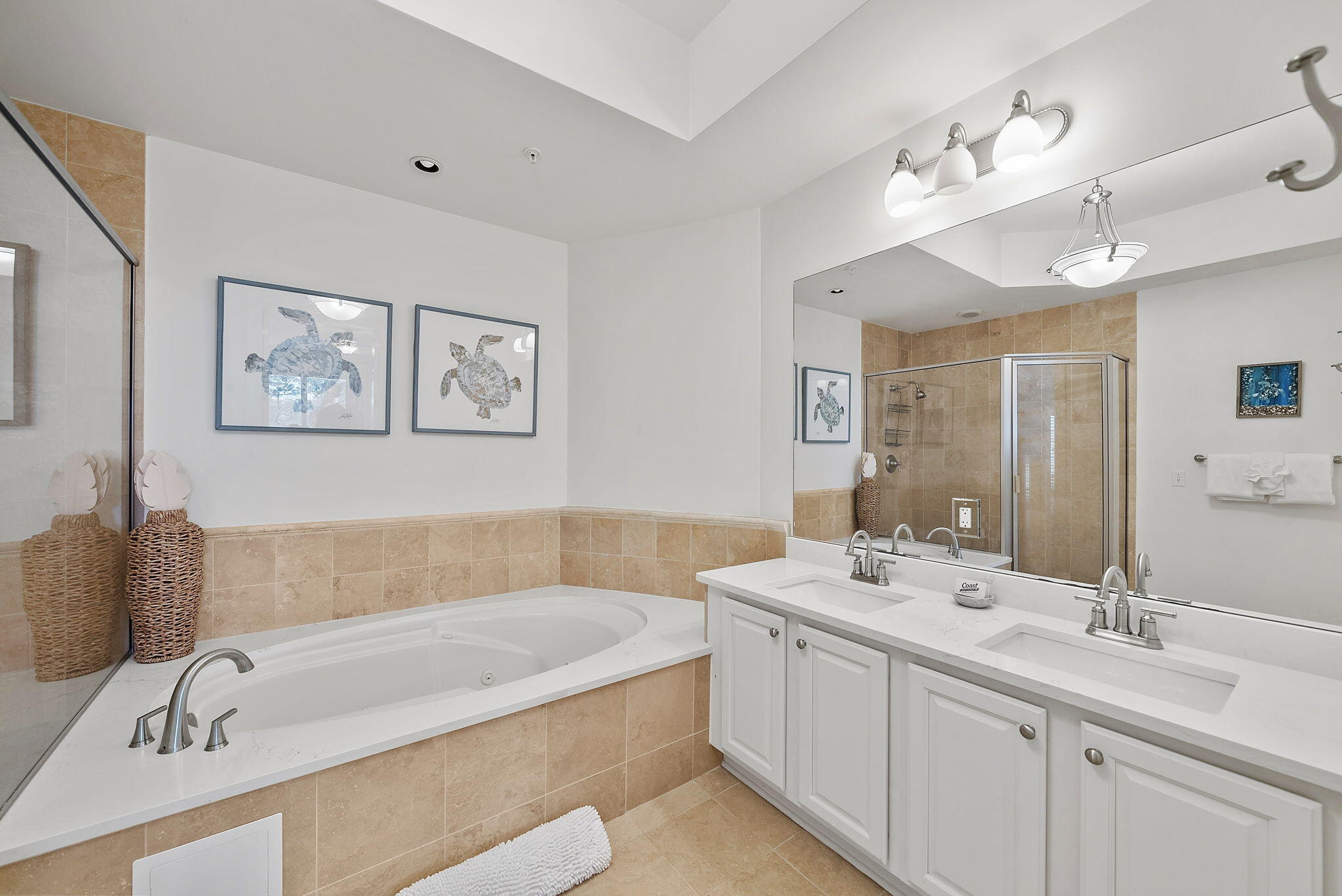 1653 West County Highway 30A, Unit 2105 Santa Rosa Beach, FL 32459 - Photo 15 of 42 a bathroom with a tub a double vanity sink and a mirror