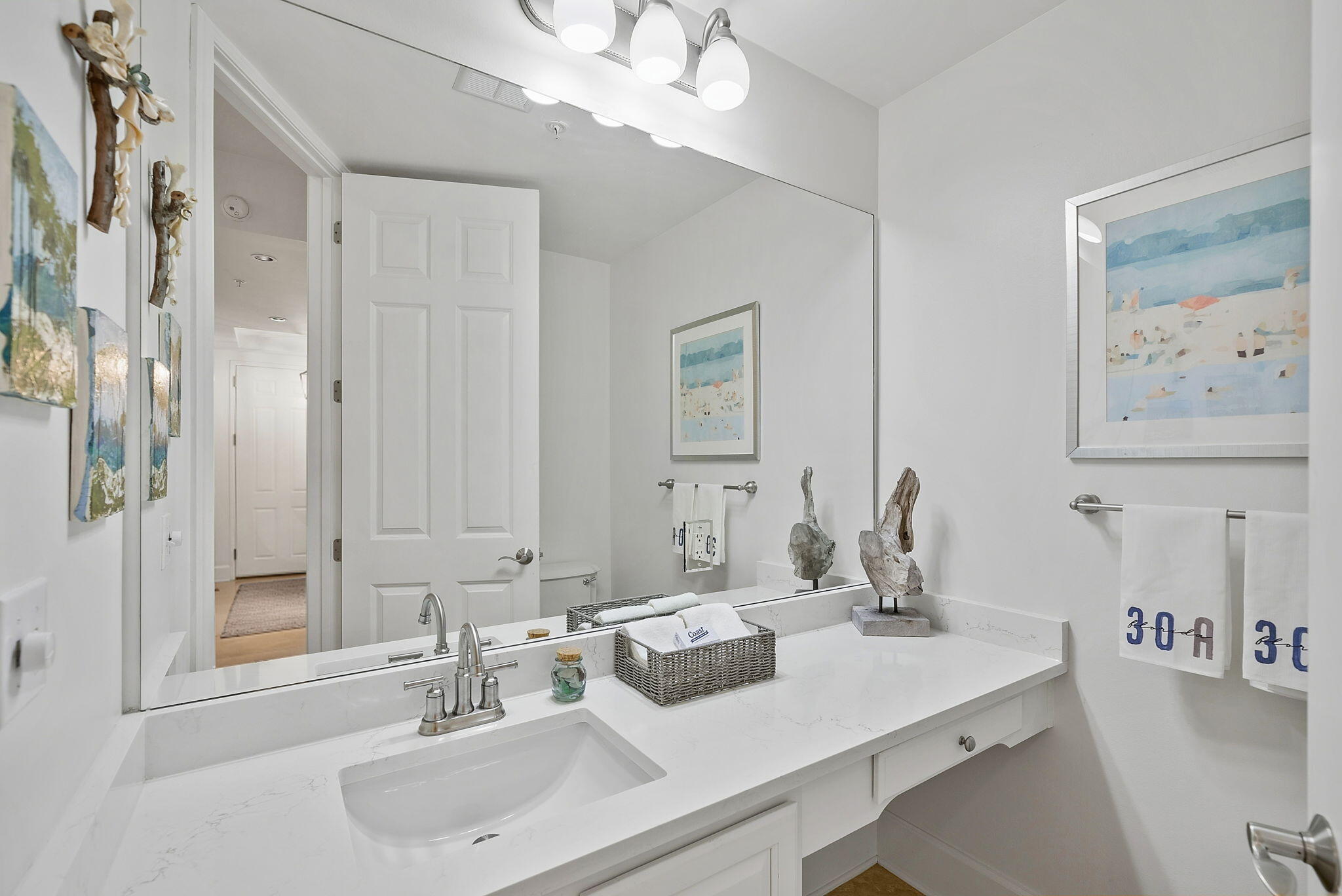 1653 West County Highway 30A, Unit 2105 Santa Rosa Beach, FL 32459 - Photo 28 of 42 a bathroom with a sink and a mirror