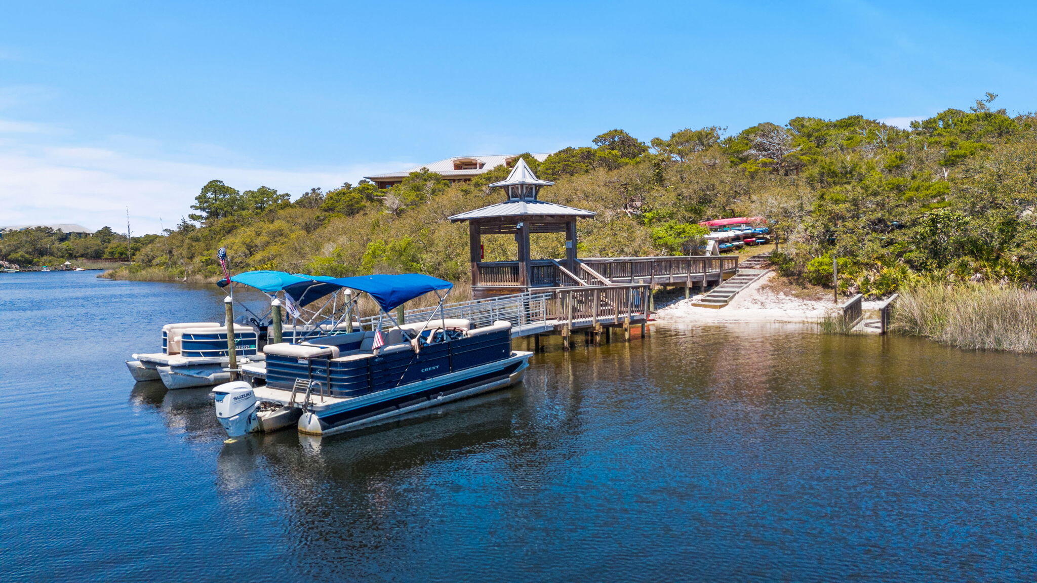 1653 West County Highway 30A, Unit 2105 Santa Rosa Beach, FL 32459 - Photo 36 of 42 a view of a lake with a chairs in roof deck