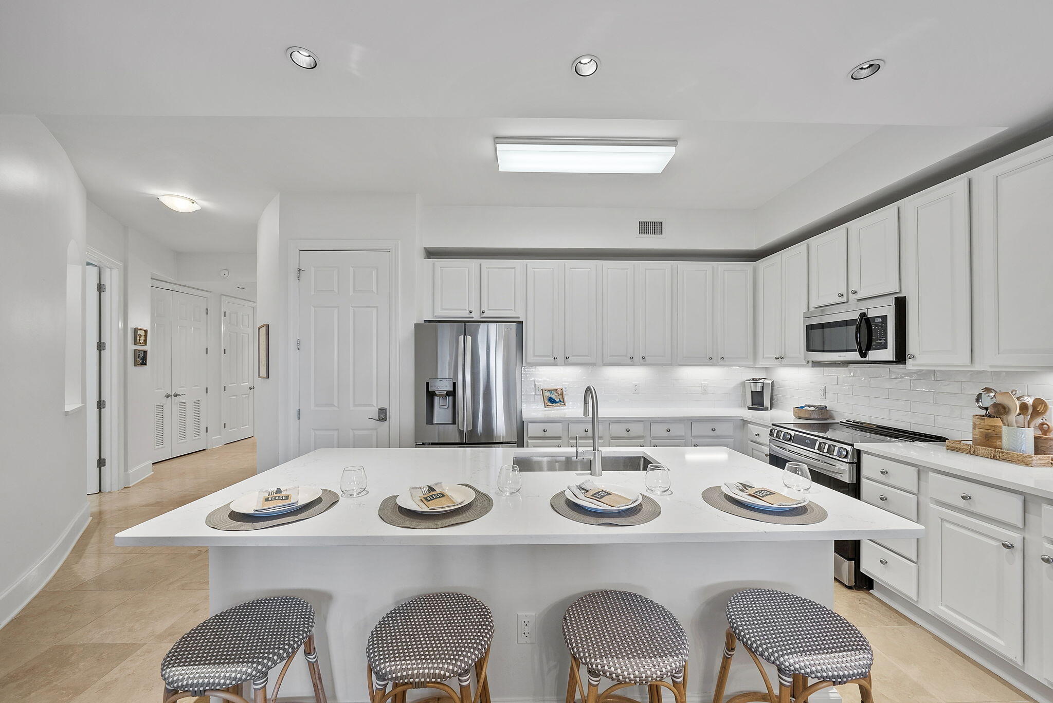 1653 West County Highway 30A, Unit 2105 Santa Rosa Beach, FL 32459 - Photo 7 of 42 a kitchen that has a dining table and chairs