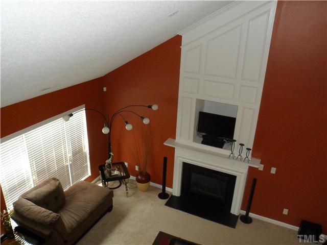 2909 Trassacks Drive Raleigh, NC 27610 - Photo 3 of 25 The two story cathedral ceiling Family Room features a Floor to Ceiling Fireplace with TV Niche. Look at all the detail in the woodwork.