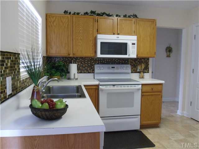 2909 Trassacks Drive Raleigh, NC 27610 - Photo 9 of 25 The Glass Tile Backsplash is awesome!!!