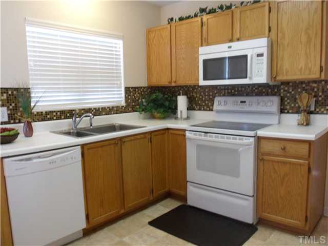 2909 Trassacks Drive Raleigh, NC 27610 - Photo 10 of 25 This Kitchen is just inviting you to coming in to cook...