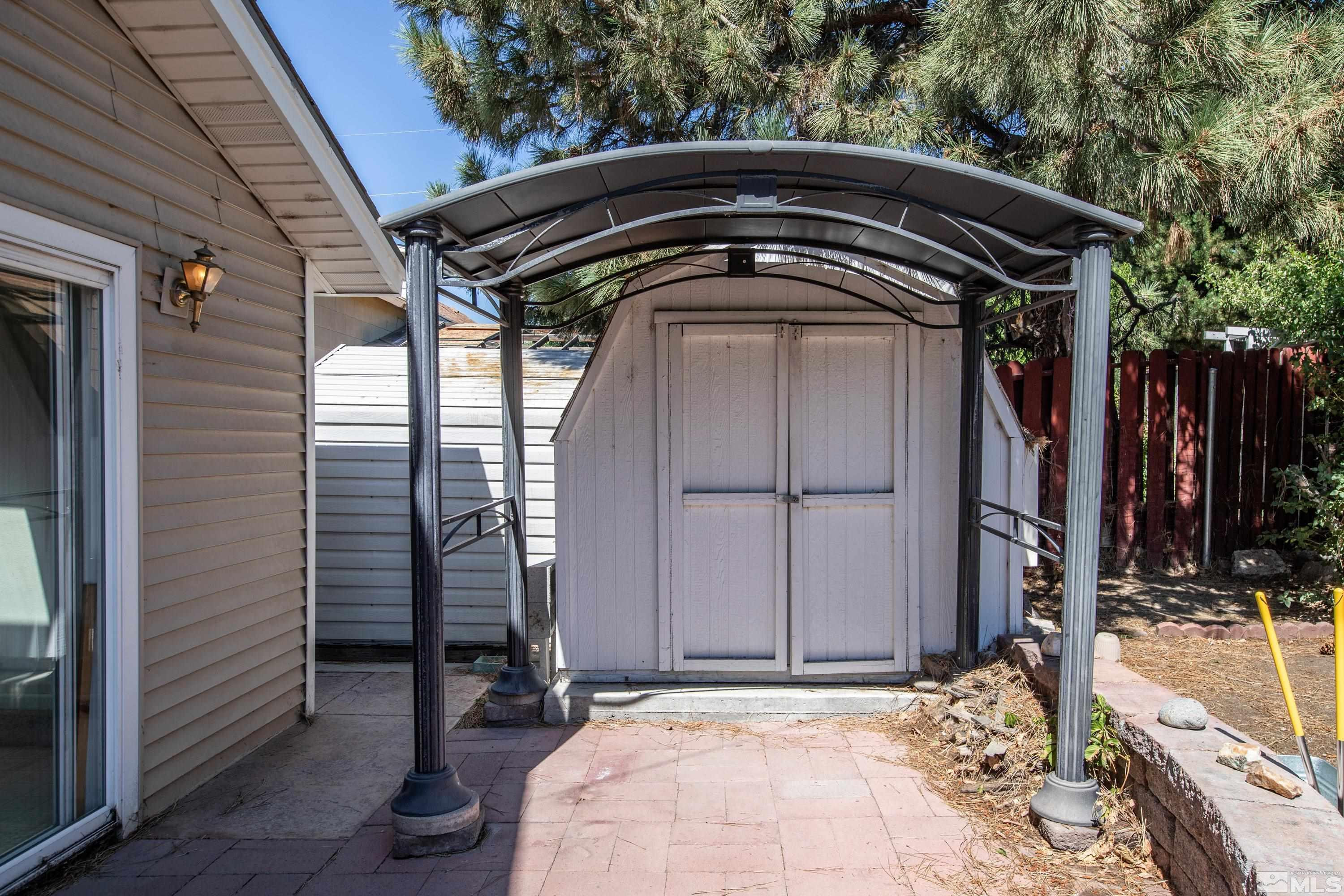 2555 Dyer Way Reno, NV 89512 - Photo 18 of 18 a front view of a house with garden