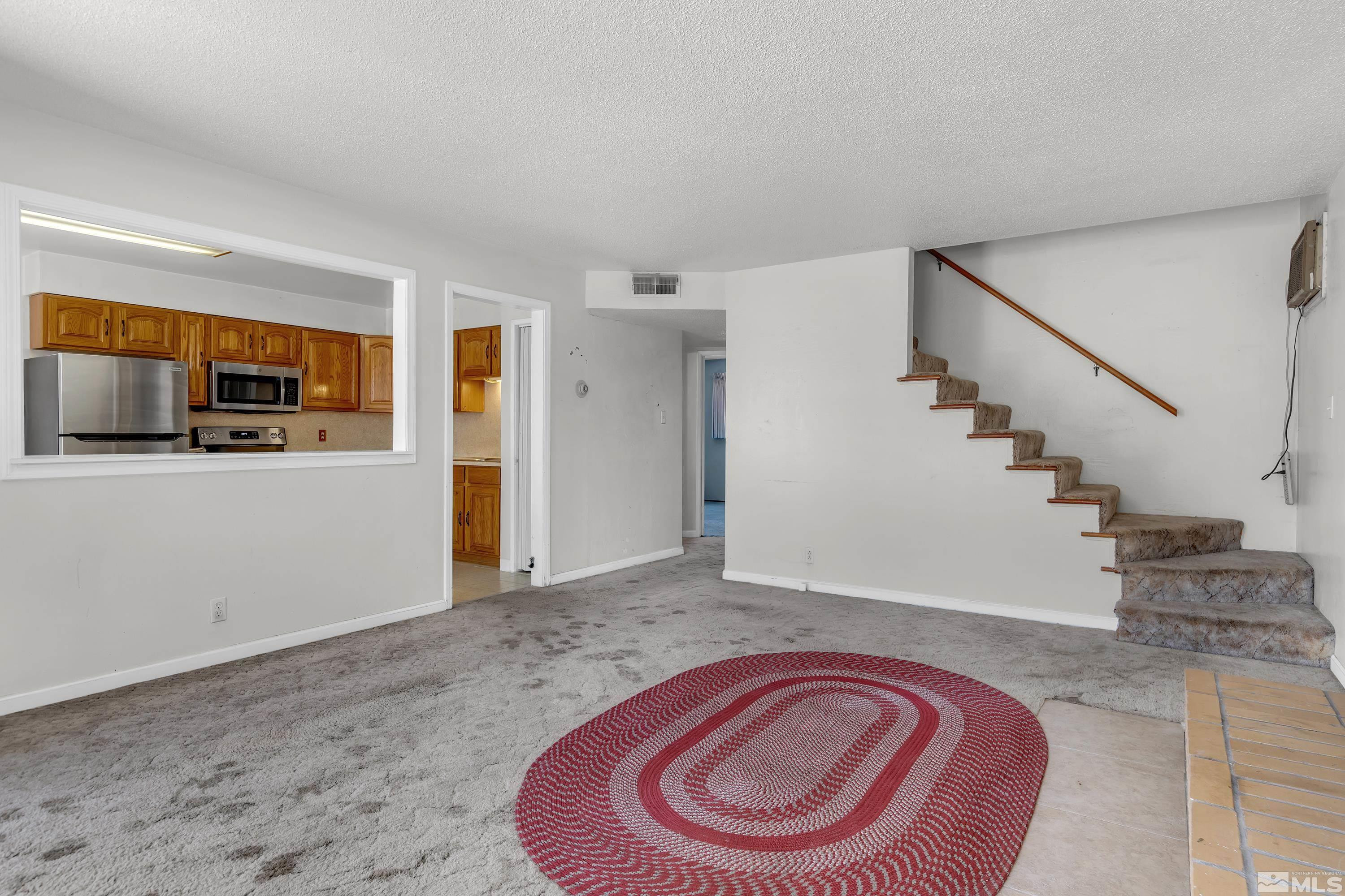 2555 Dyer Way Reno, NV 89512 - Photo 5 of 18 a view of empty room with wooden floor