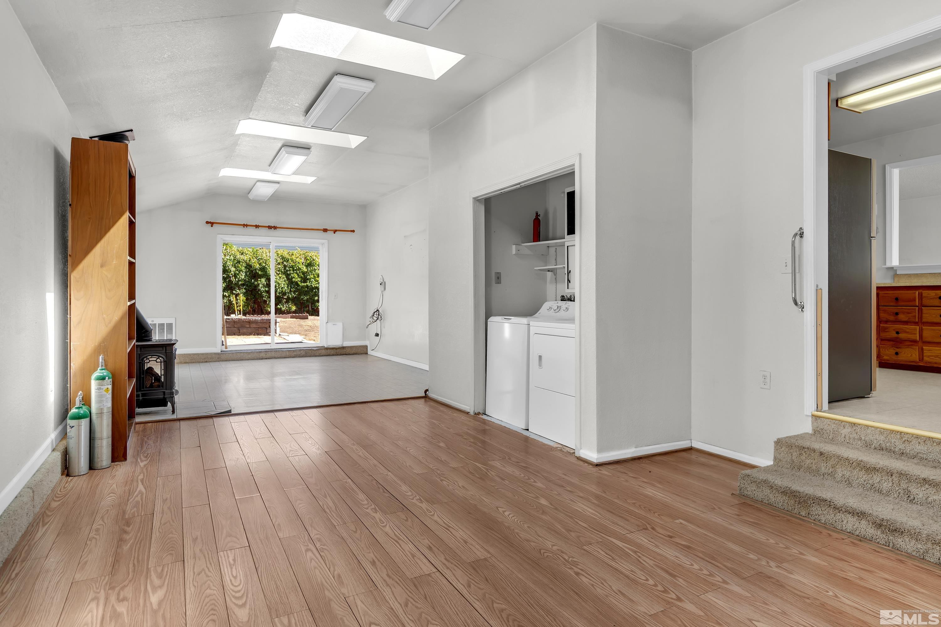2555 Dyer Way Reno, NV 89512 - Photo 8 of 18 a view of empty room with wooden floor and fan