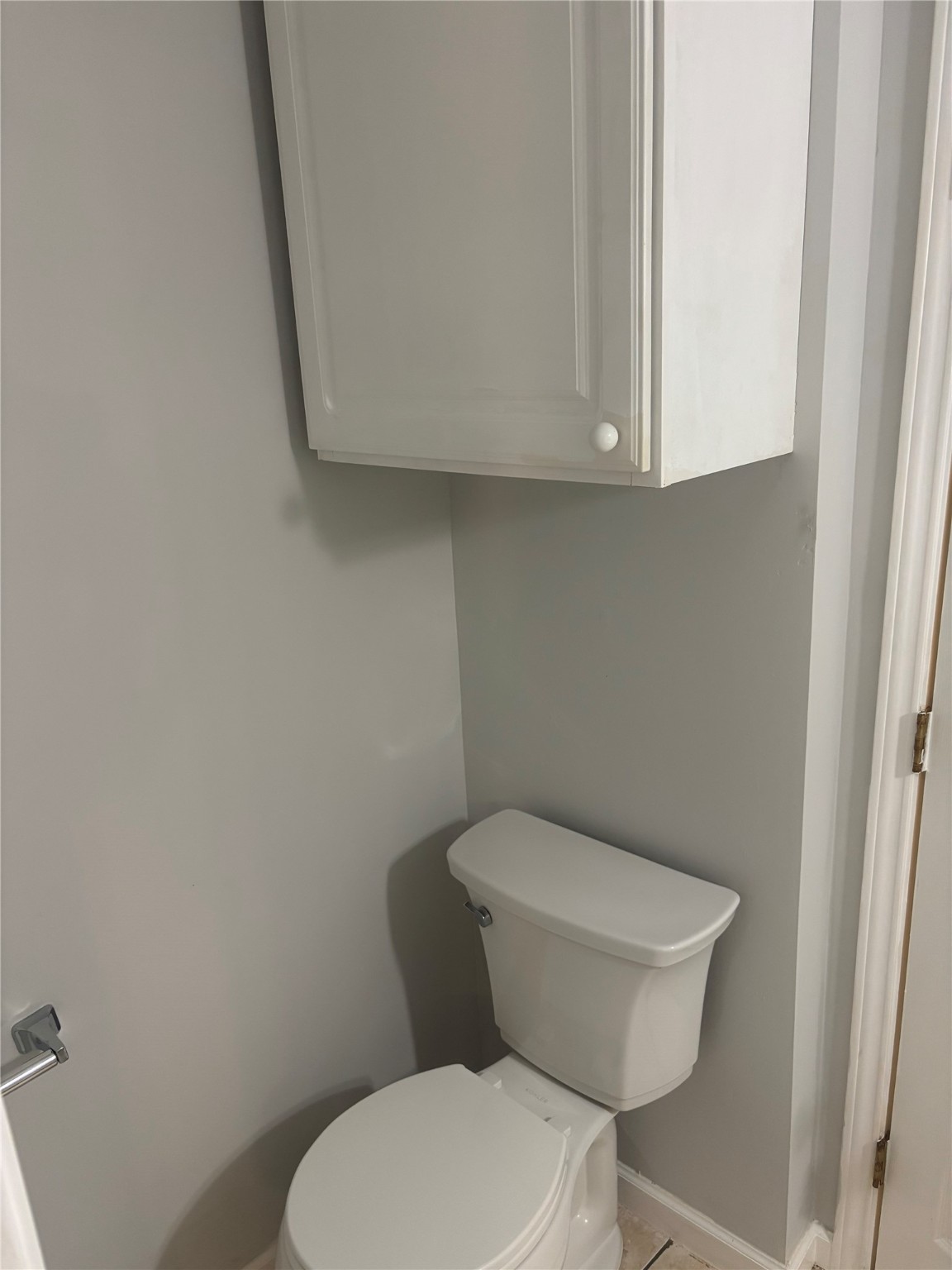 14333 Memorial Drive, Unit 39 Houston, TX 77079 - Photo 15 of 20 a white toilet sitting next to a white cabinet