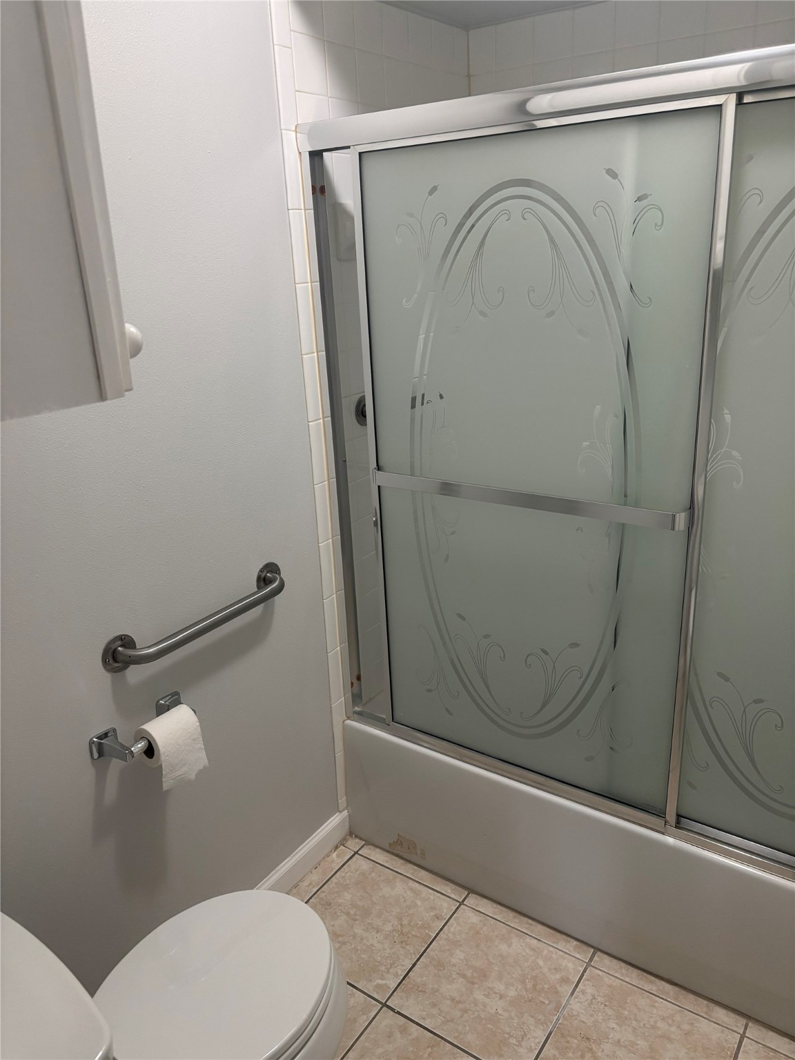 14333 Memorial Drive, Unit 39 Houston, TX 77079 - Photo 16 of 20 a bathroom with a granite countertop toilet and a shower