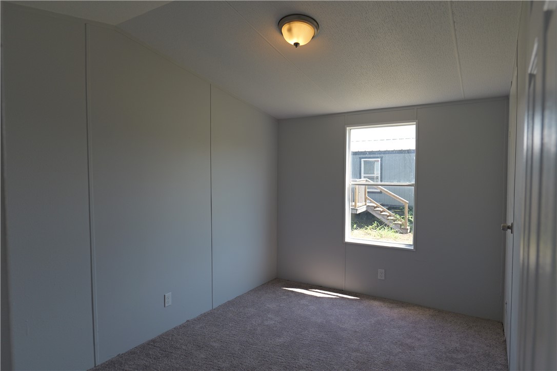 732 D Rogers Street Normangee, TX 77871 - Photo 11 of 12 an empty room that has a window