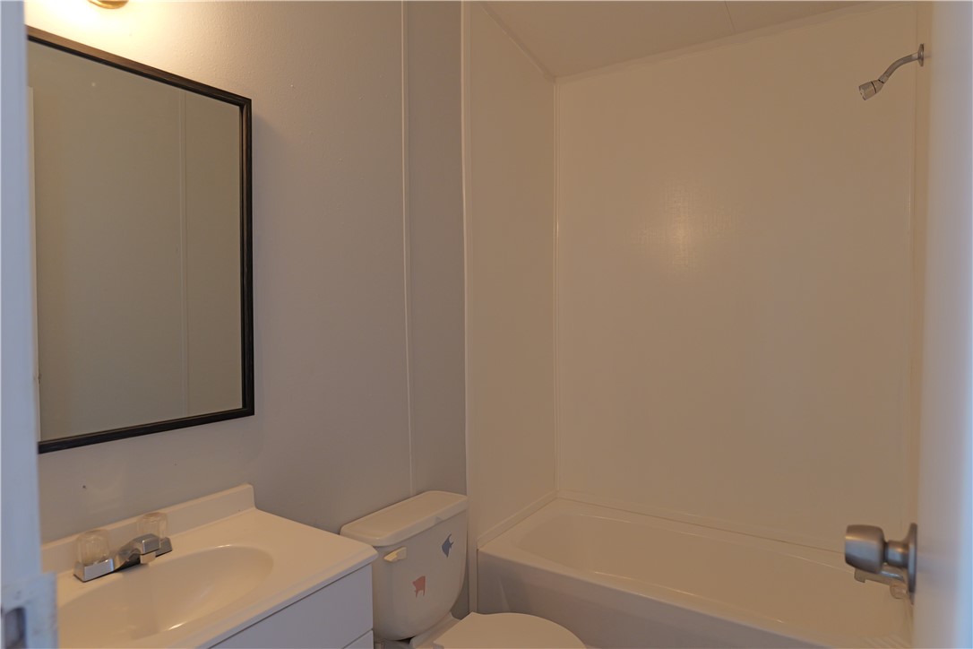 732 D Rogers Street Normangee, TX 77871 - Photo 12 of 12 a bathroom with a sink and a mirror