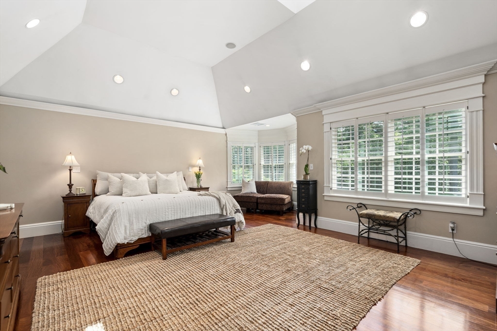 3 Stone Bridge Lane Milton, MA 02186 - Photo 20 of 37 a spacious bedroom with a bed a table and chair