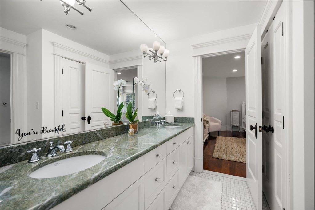 3 Stone Bridge Lane Milton, MA 02186 - Photo 24 of 37 a bathroom with a granite countertop double vanity sinks and a mirror