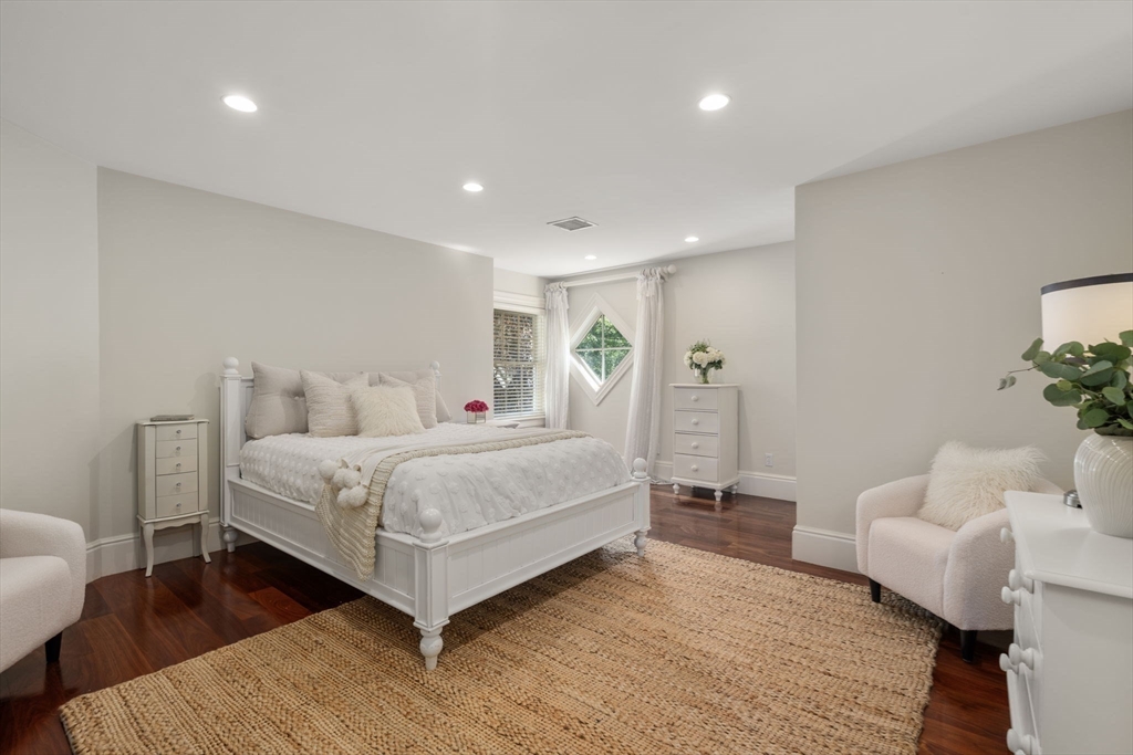 3 Stone Bridge Lane Milton, MA 02186 - Photo 25 of 37 a bedroom with a bed and a couch