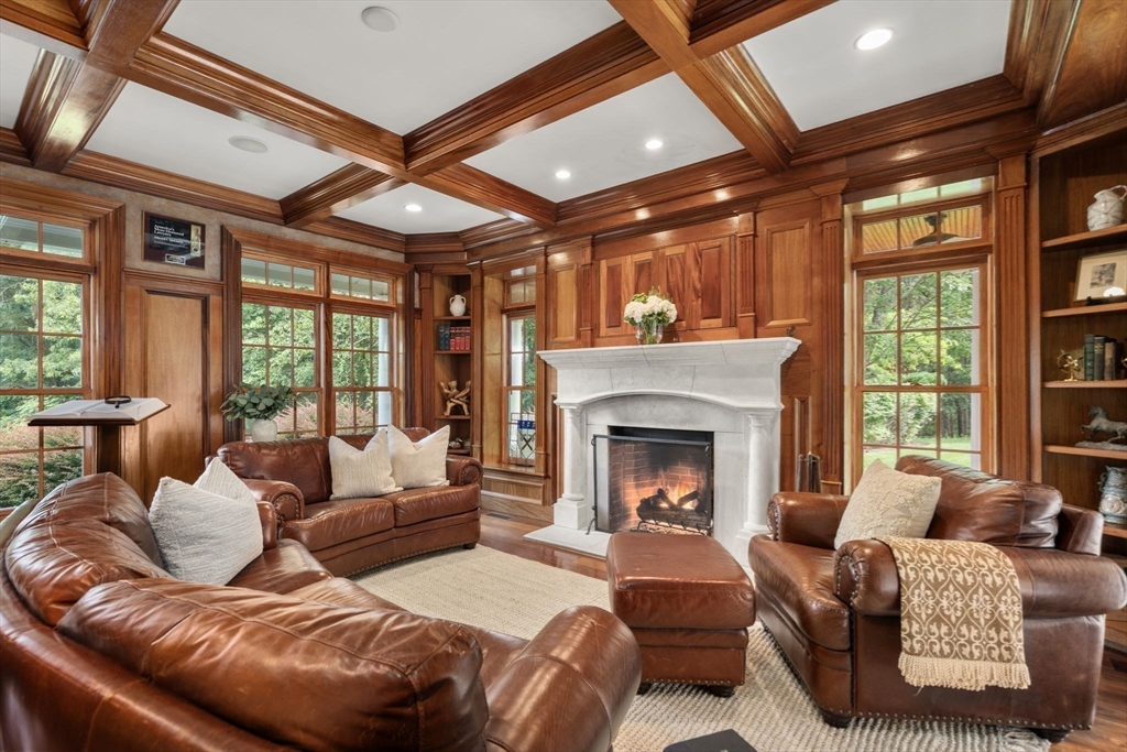 3 Stone Bridge Lane Milton, MA 02186 - Photo 9 of 37 a living room with furniture and a fireplace