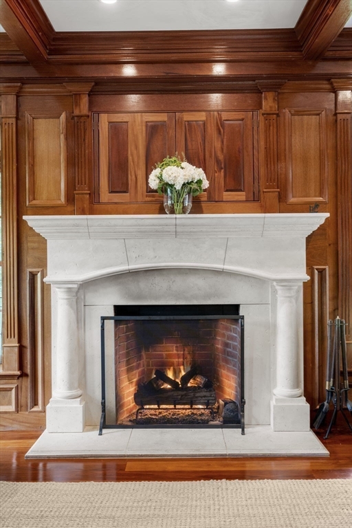 3 Stone Bridge Lane Milton, MA 02186 - Photo 10 of 37 a fireplace with two chairs