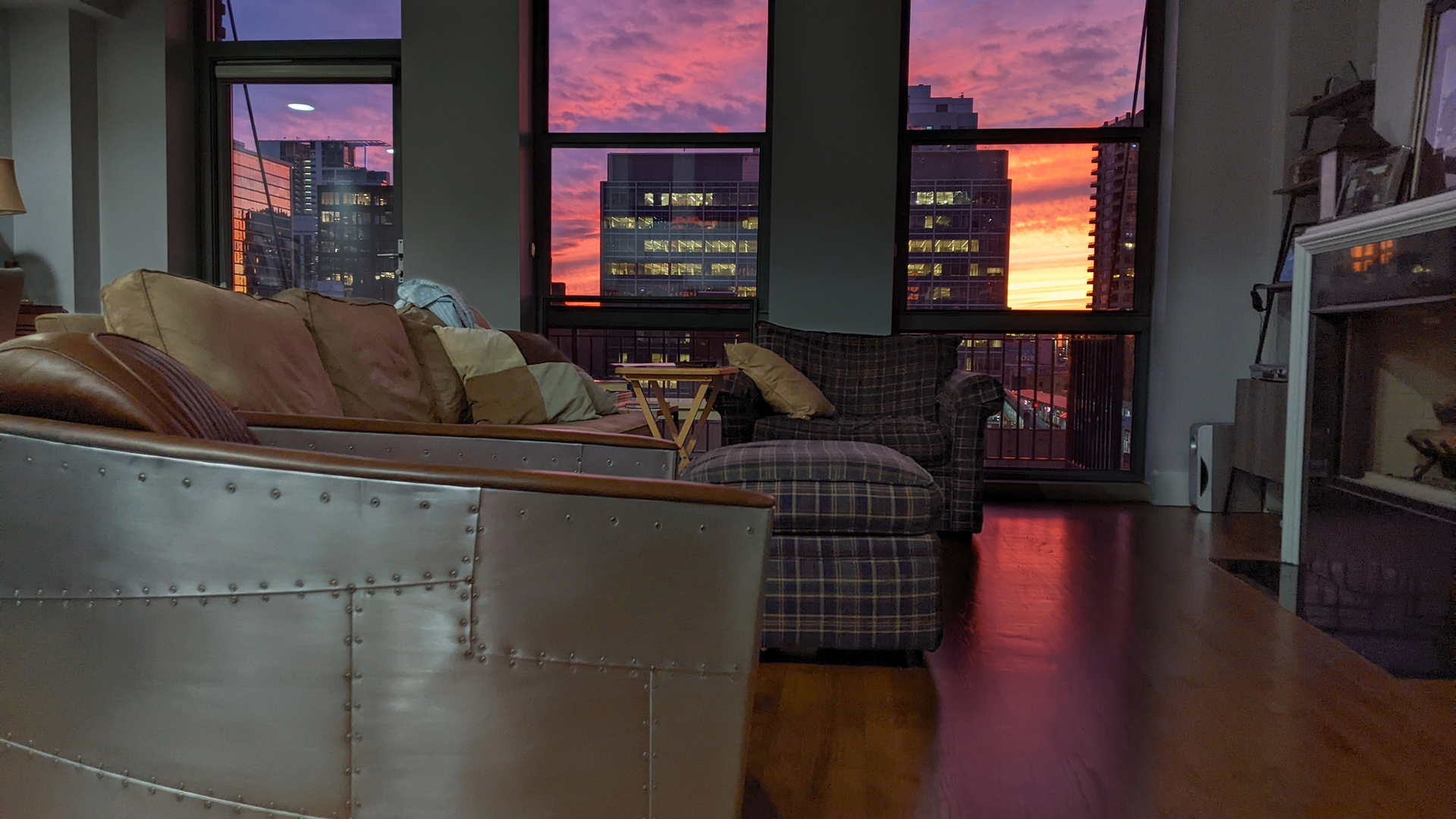 165 North Canal Street, Unit 706 Chicago, IL 60606 - Photo 21 of 27 a living room with furniture and a fireplace