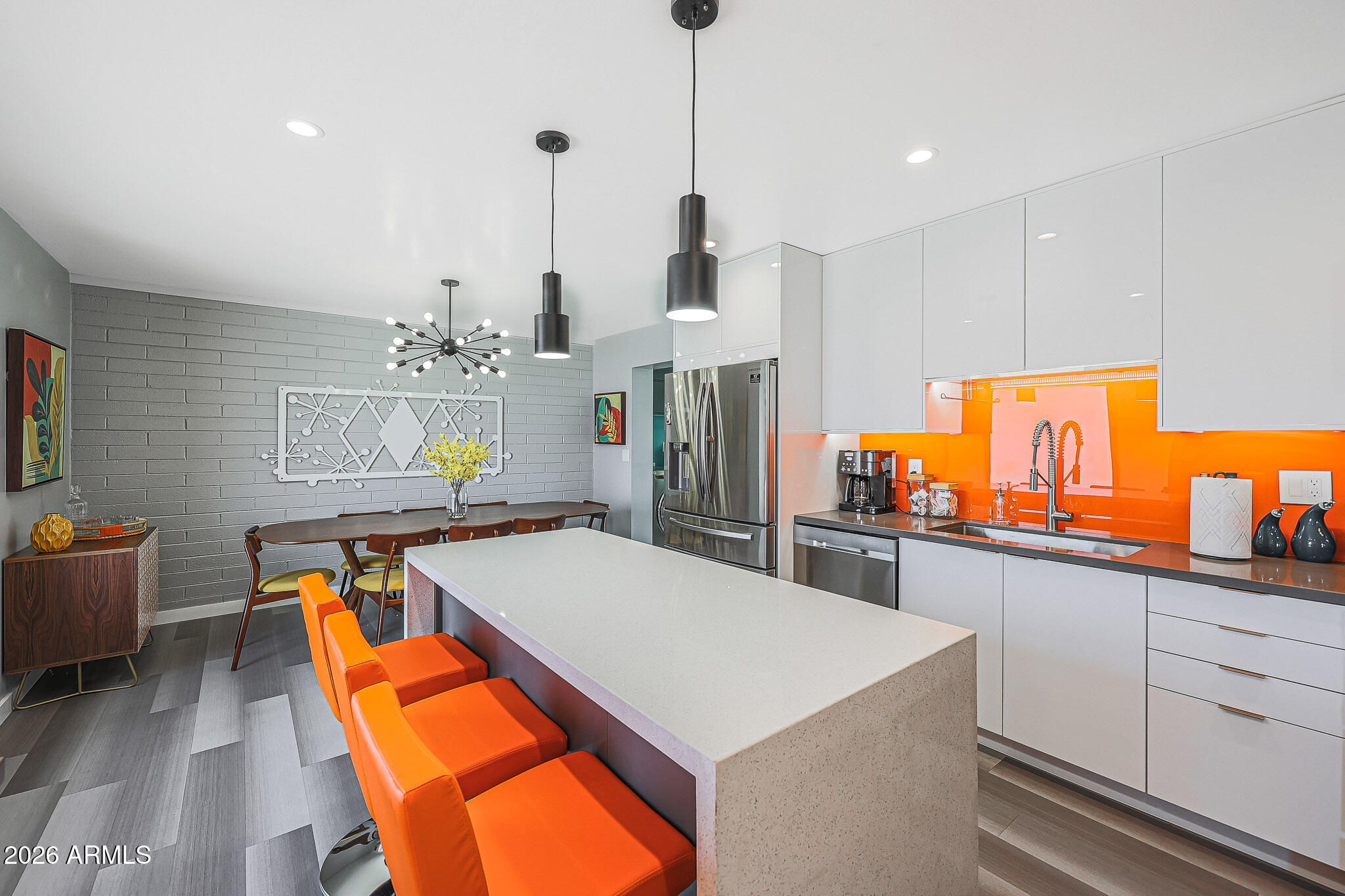 2201 East Marilyn Road Phoenix, AZ 85022 - Photo 16 of 47 a kitchen with stainless steel appliances kitchen island granite countertop a table chairs in it and a window
