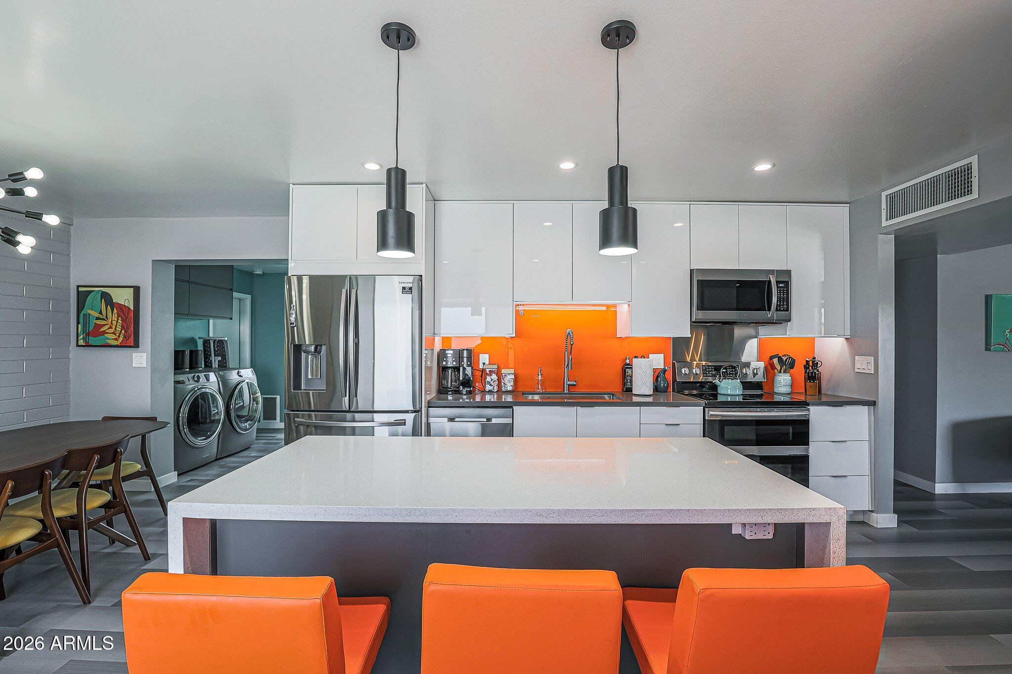 2201 East Marilyn Road Phoenix, AZ 85022 - Photo 17 of 47 a kitchen with stainless steel appliances a stove window and chairs
