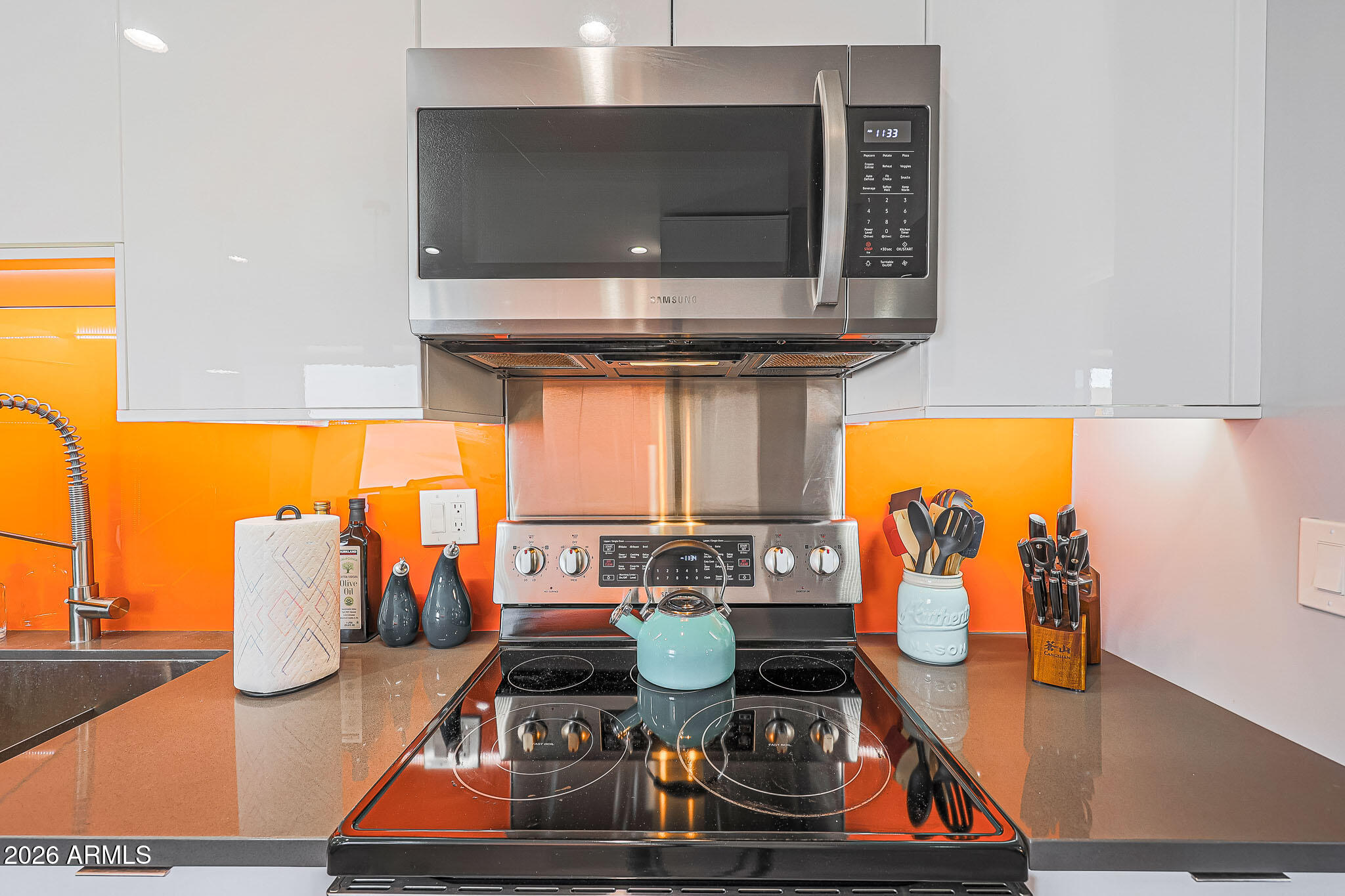 2201 East Marilyn Road Phoenix, AZ 85022 - Photo 18 of 47 a kitchen with a stove and a microwave