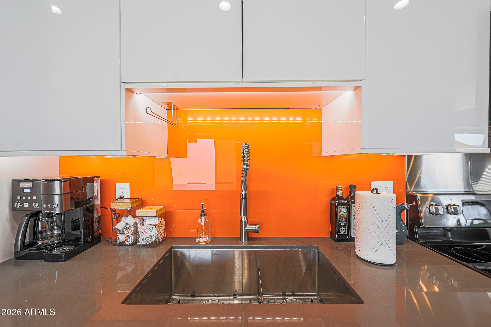 2201 East Marilyn Road Phoenix, AZ 85022 - Photo 19 of 47 a view of a kitchen with a sink and living room