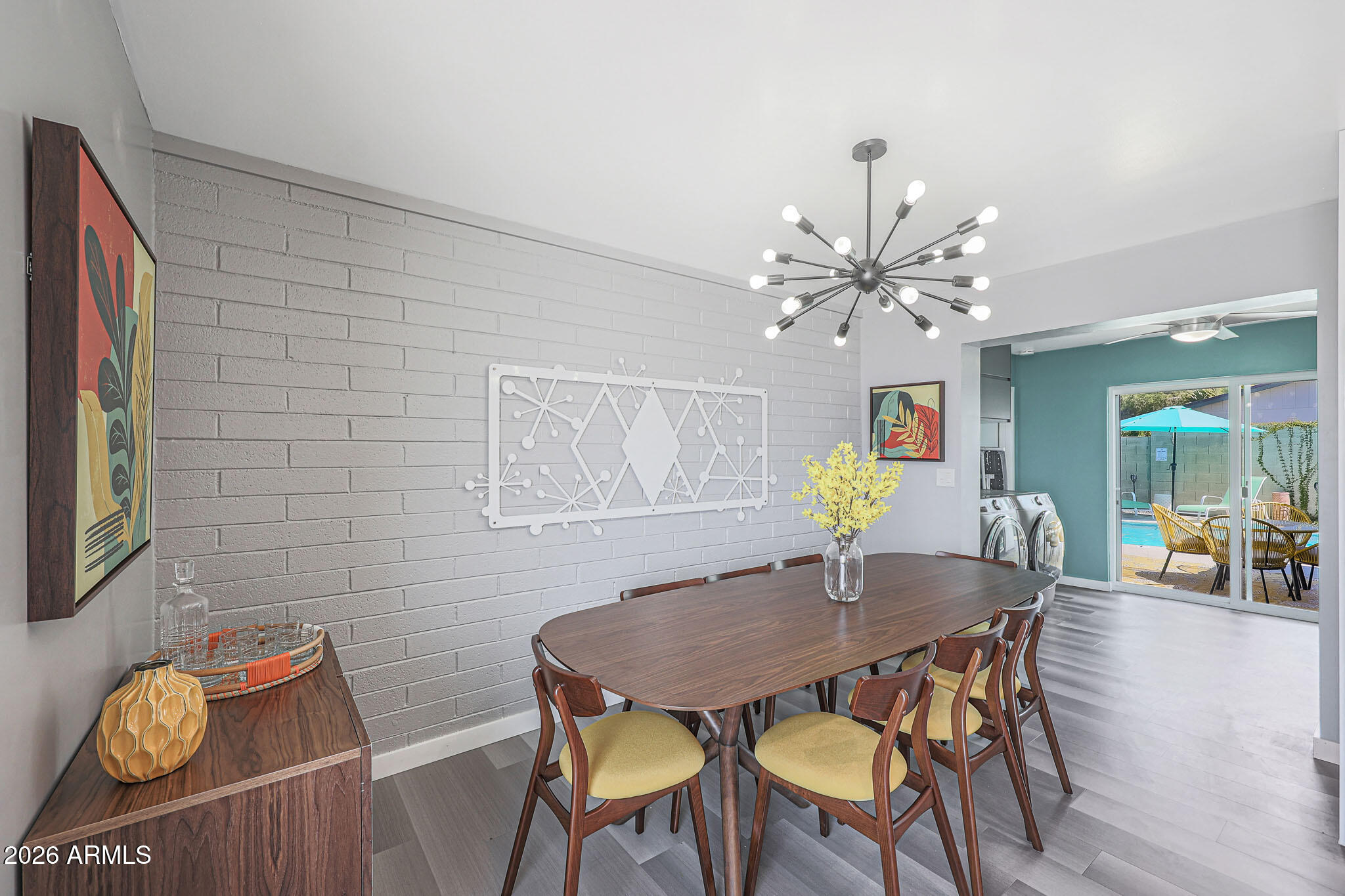 2201 East Marilyn Road Phoenix, AZ 85022 - Photo 22 of 47 a view of a dining room with furniture and wooden floor