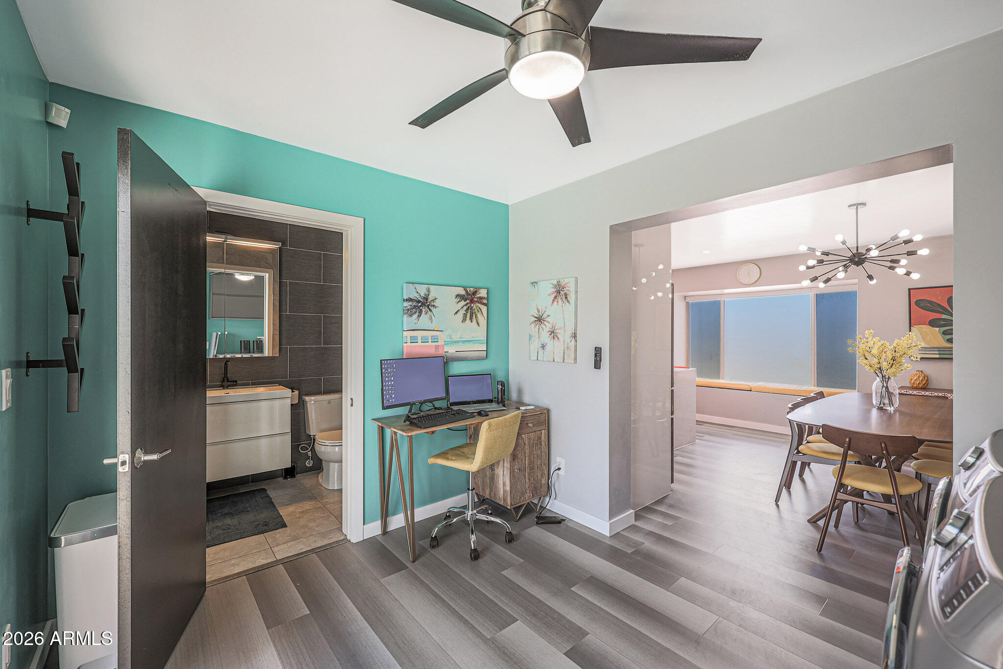 2201 East Marilyn Road Phoenix, AZ 85022 - Photo 26 of 47 a work room with furniture and a chandelier fan