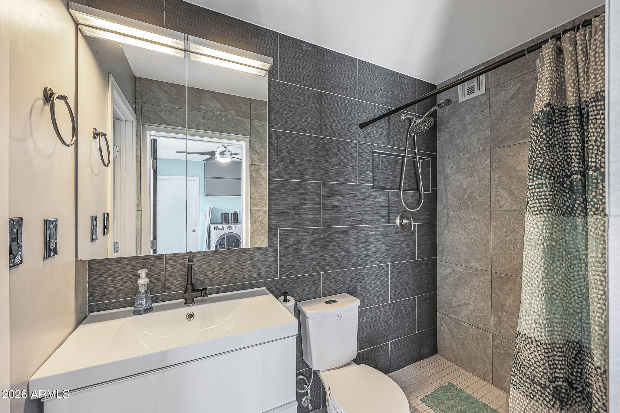 2201 East Marilyn Road Phoenix, AZ 85022 - Photo 27 of 47 a bathroom with a sink toilet and shower