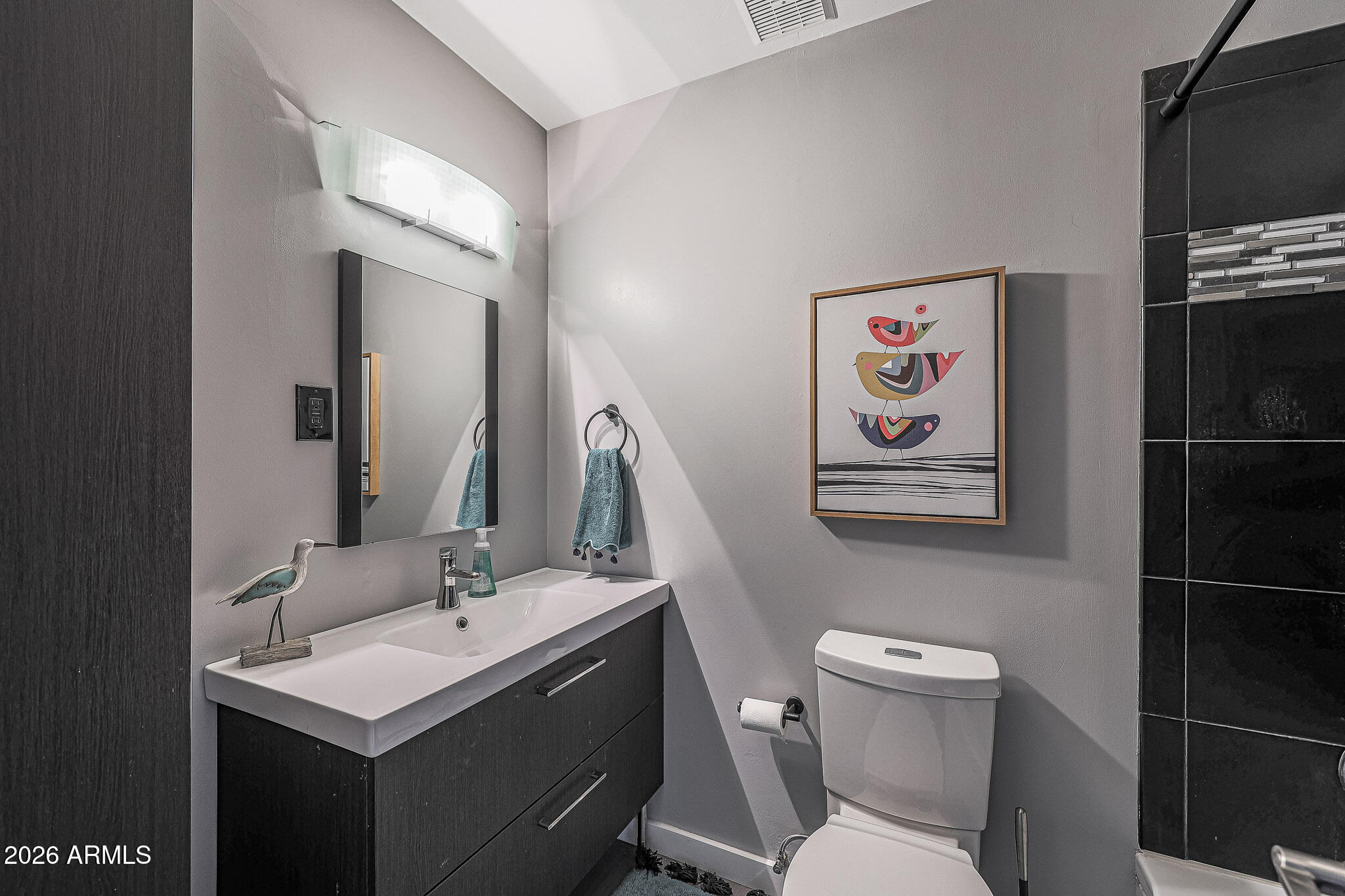 2201 East Marilyn Road Phoenix, AZ 85022 - Photo 31 of 47 a bathroom with a sink mirror and toilet