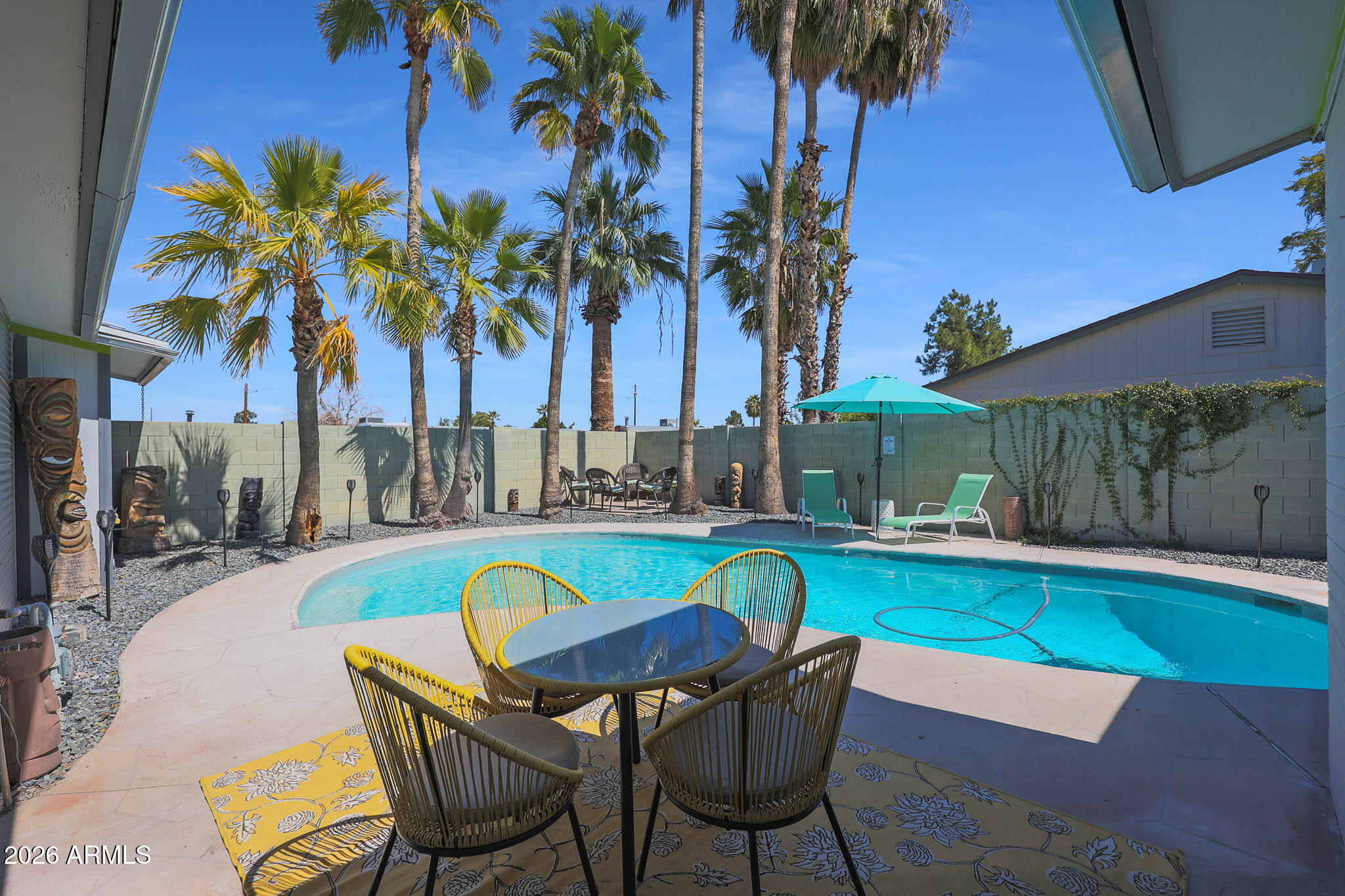 2201 East Marilyn Road Phoenix, AZ 85022 - Photo 37 of 47 a swimming pool with outdoor seating and yard