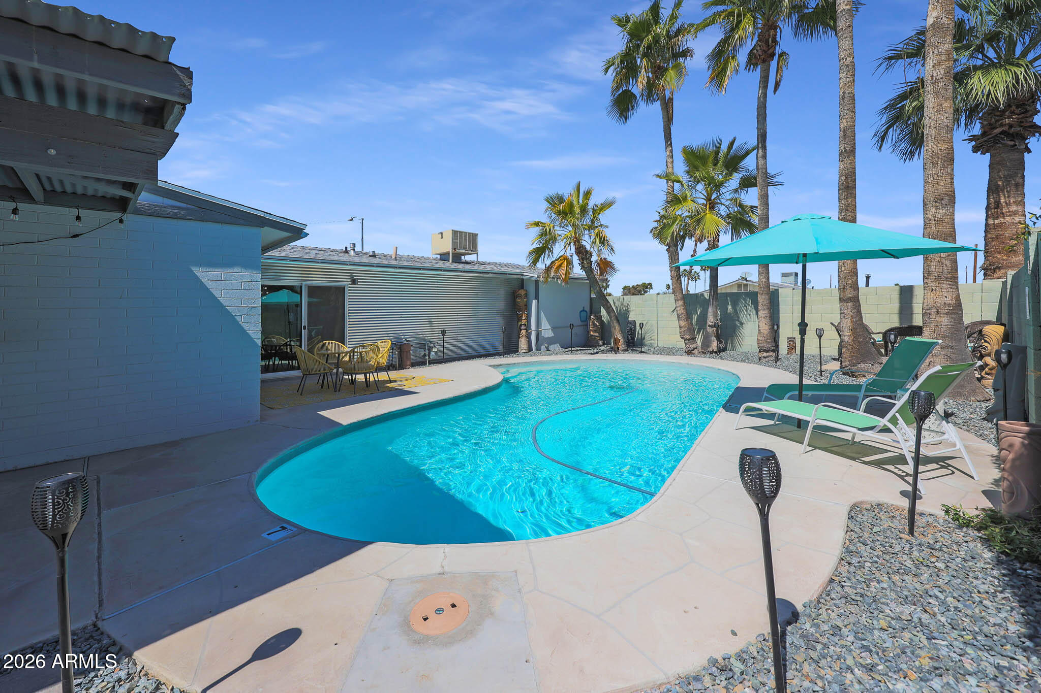 2201 East Marilyn Road Phoenix, AZ 85022 - Photo 40 of 47 a view of a swimming pool with chairs