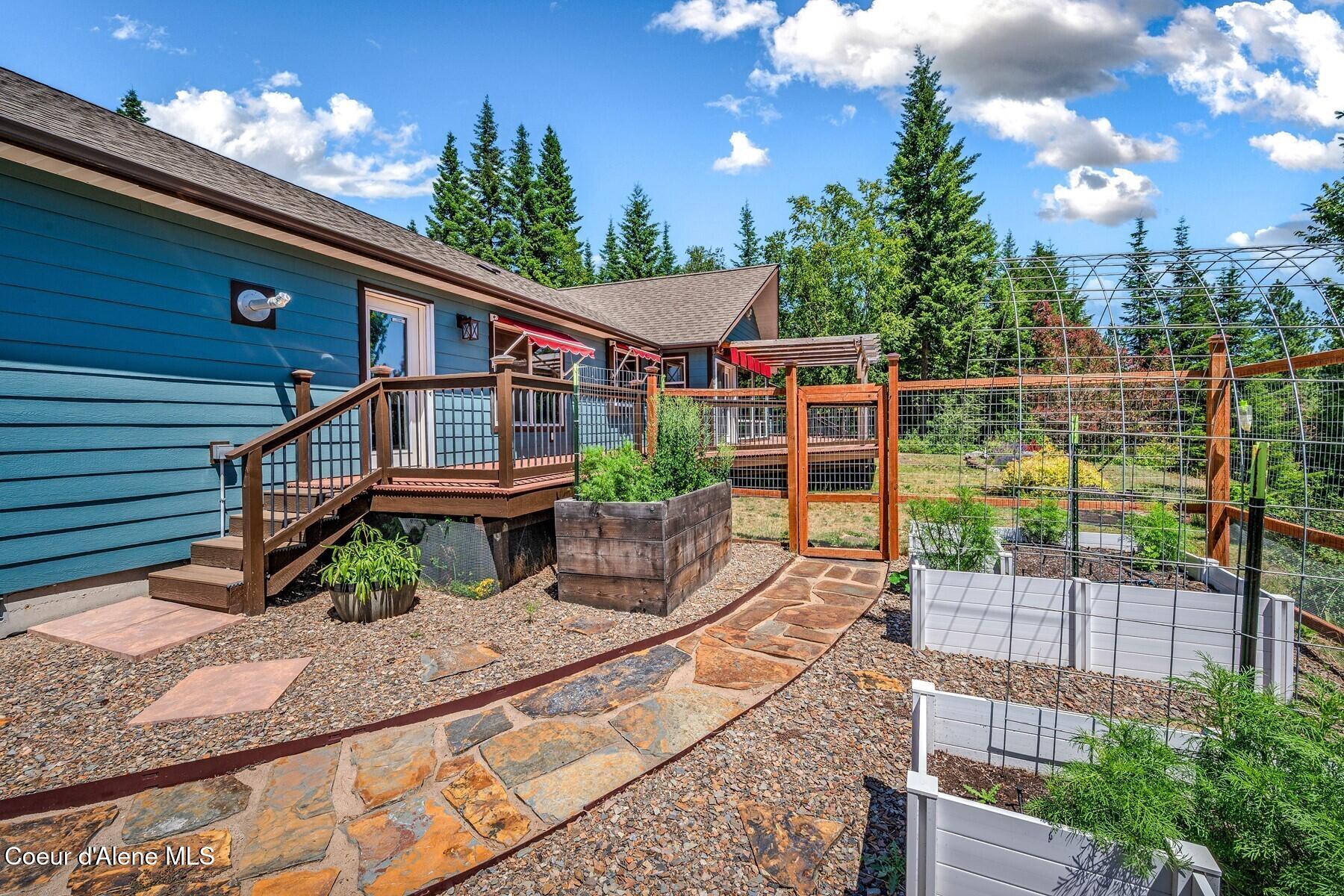 218 Topaz Trail Sandpoint, ID 83864 - Photo 49 of 70 Fenced Garden - Stone Path