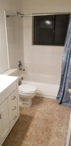 a bathroom with a toilet a sink and bathtub