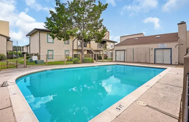 a view of a house with a swimming pool