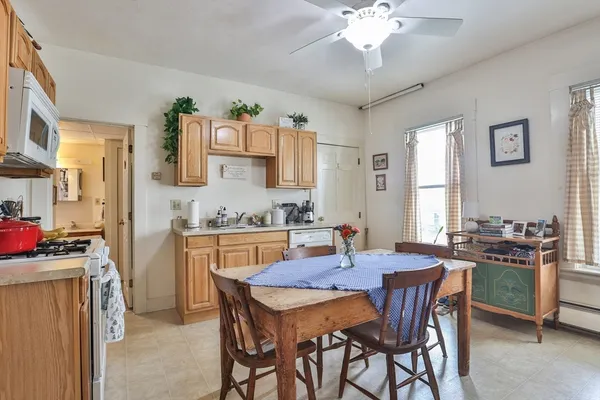 a view of a dining room with furniture and chandelier