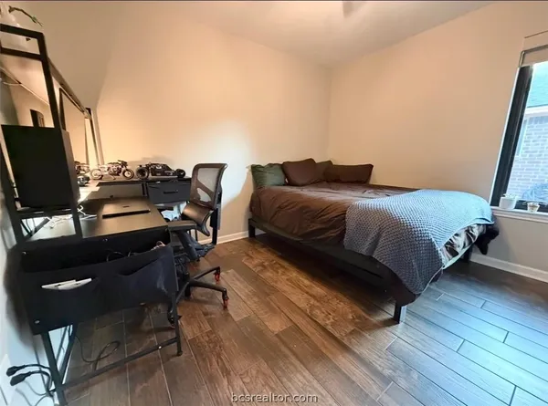 a white toilet sitting next to a shower curtain