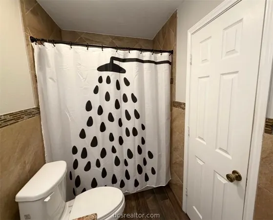 a bathroom with a shower and a tub