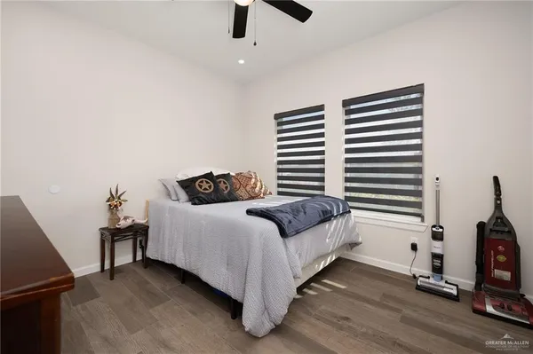 a bedroom with a bed and a television