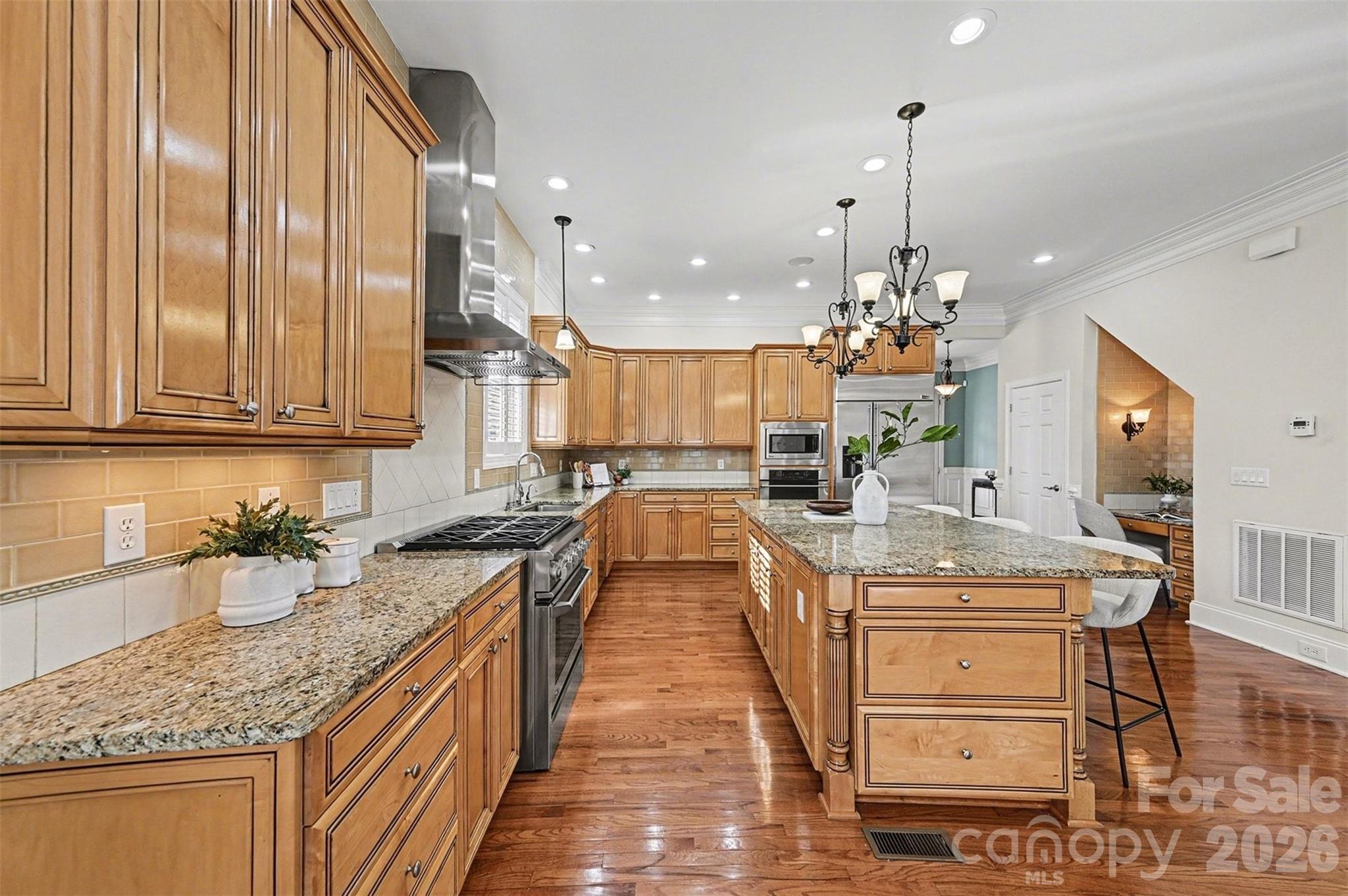 17531 Meadow Bottom Road Charlotte, NC 28277 - Photo 11 of 47 a kitchen with stainless steel appliances granite countertop a sink stove and cabinets