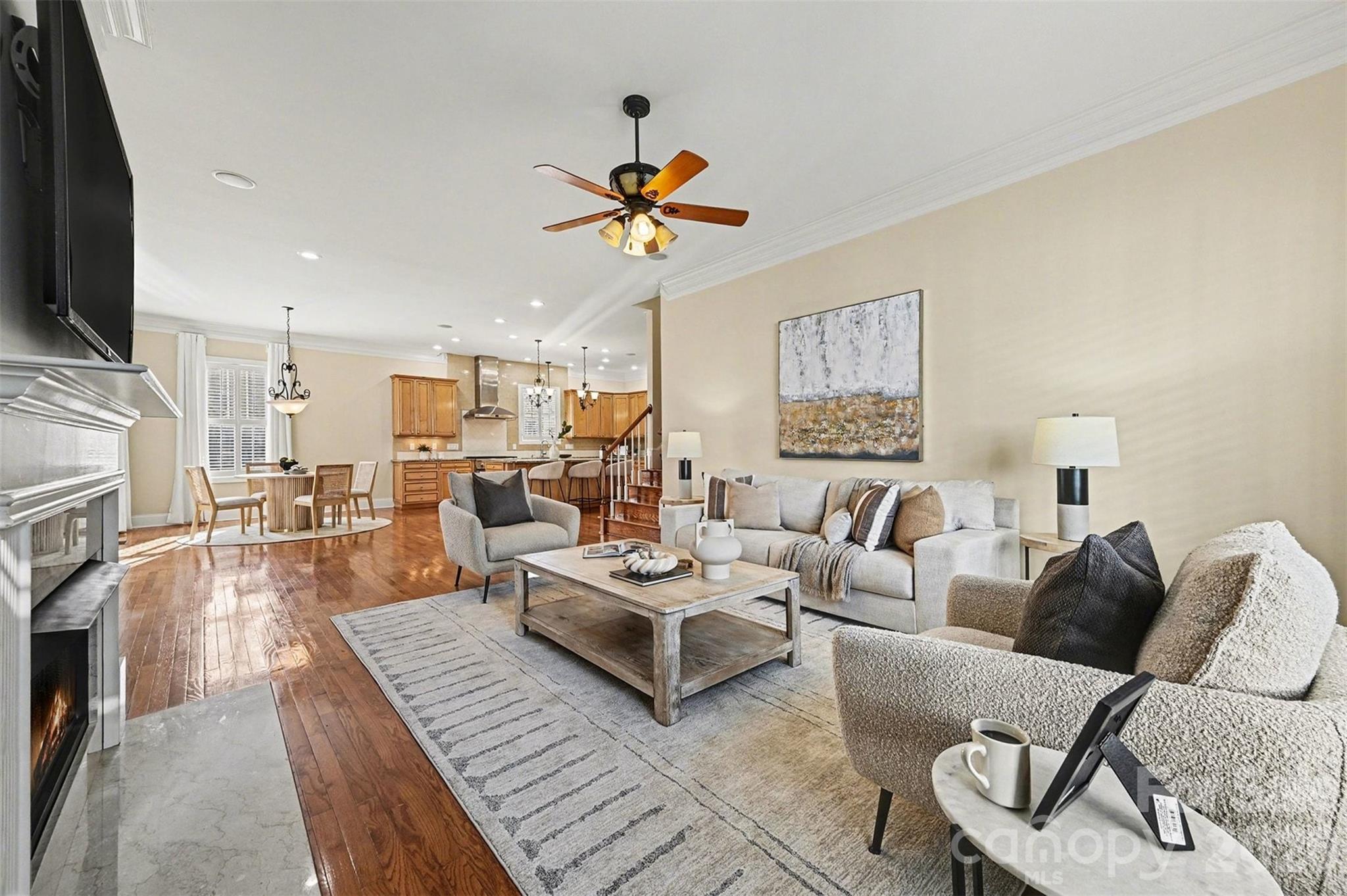 17531 Meadow Bottom Road Charlotte, NC 28277 - Photo 17 of 47 a living room with furniture a flat screen tv and a fireplace