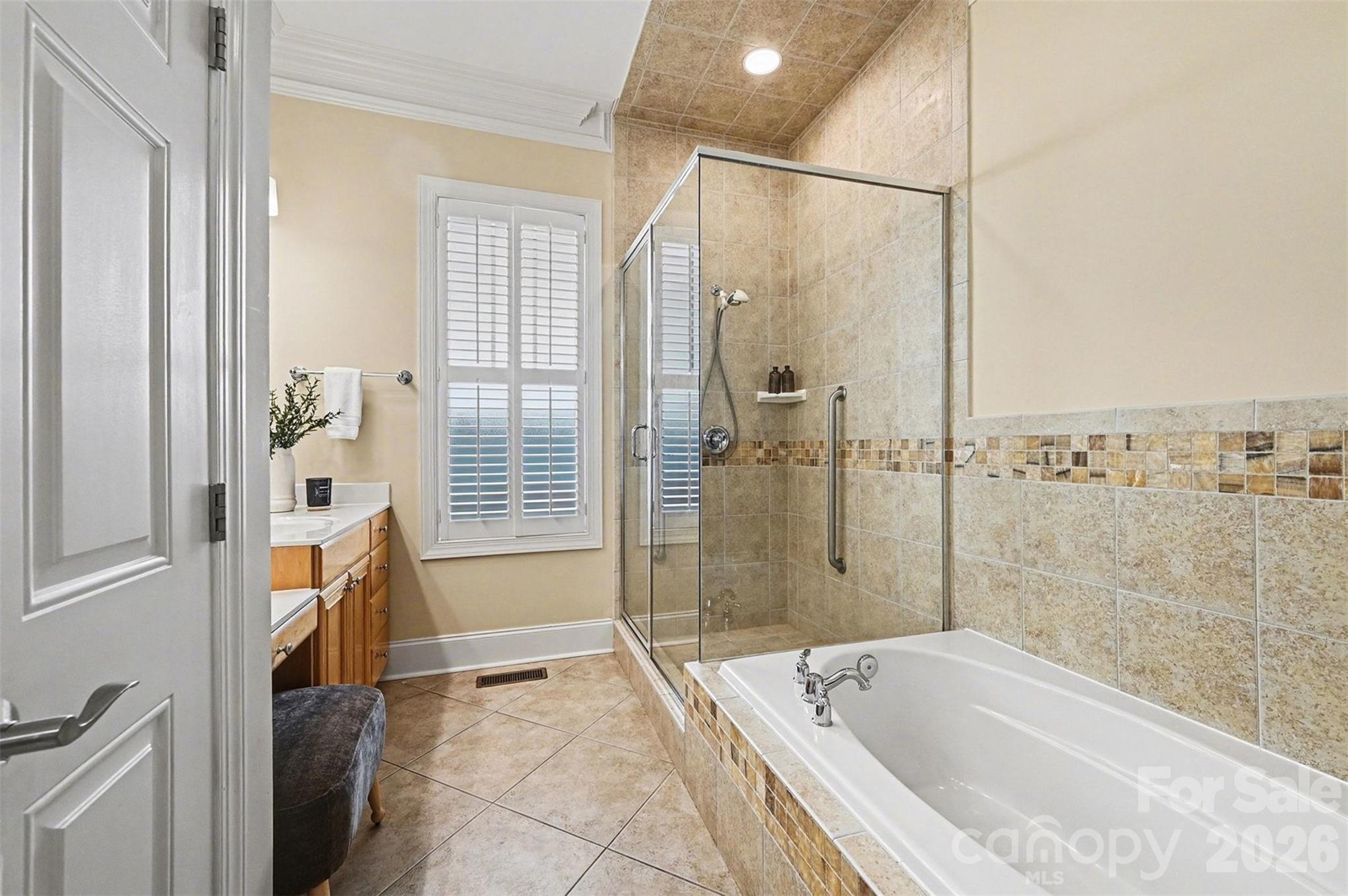 17531 Meadow Bottom Road Charlotte, NC 28277 - Photo 26 of 47 a bathroom with a tub shower and sink