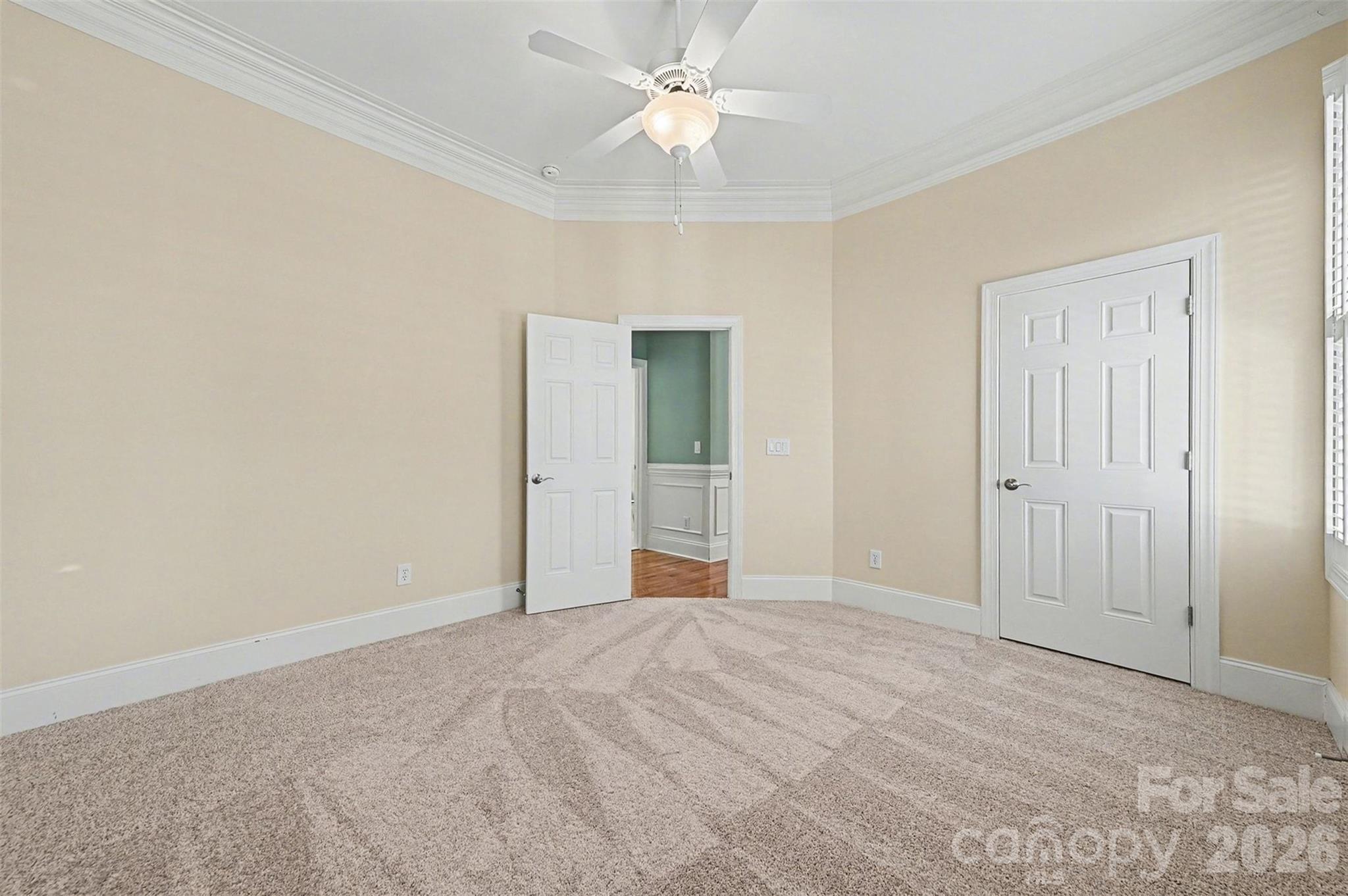 17531 Meadow Bottom Road Charlotte, NC 28277 - Photo 32 of 47 a view of an empty room and chandelier fan