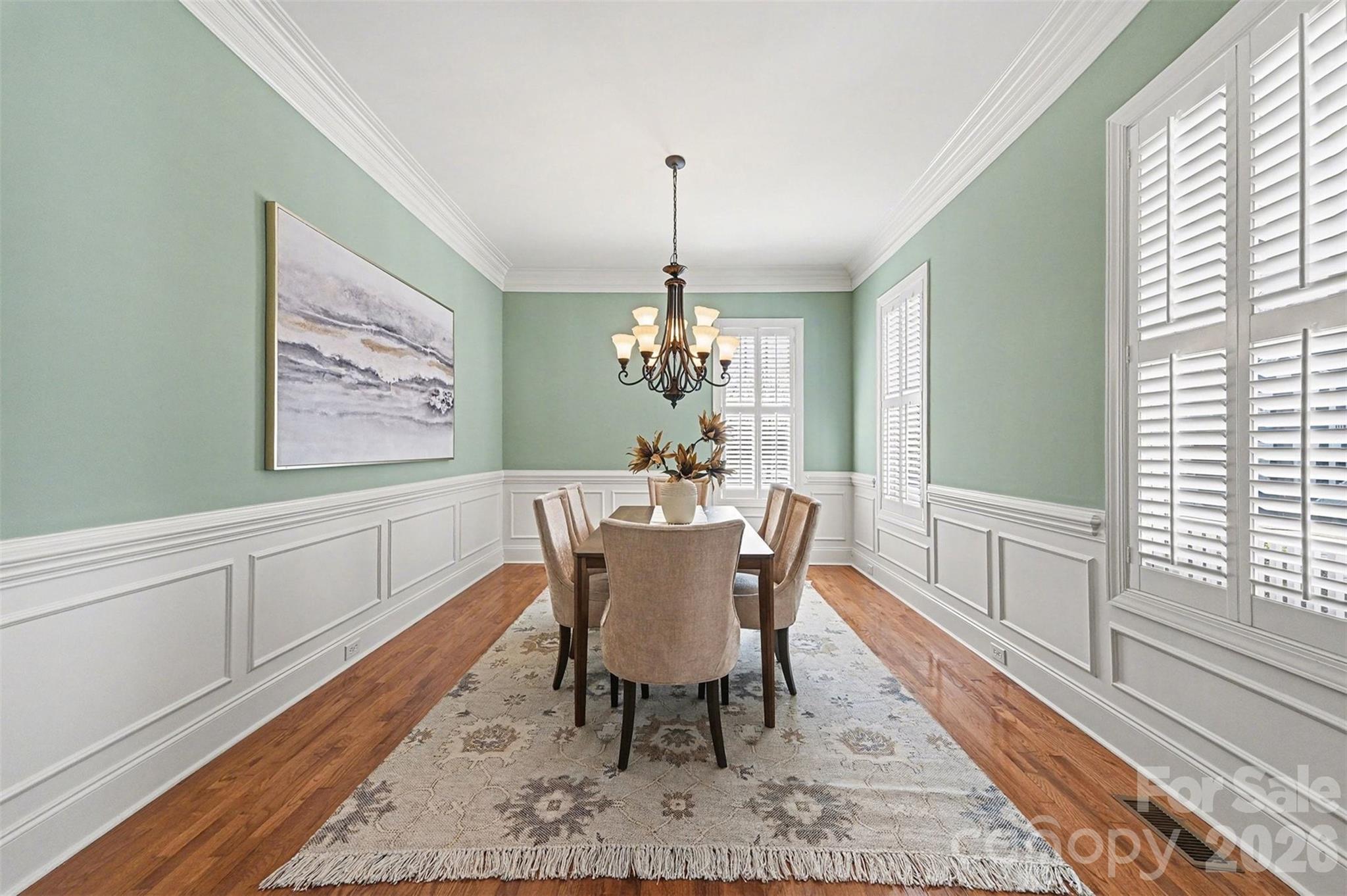 17531 Meadow Bottom Road Charlotte, NC 28277 - Photo 8 of 47 a dining room with furniture a rug and wooden floor