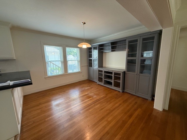 2312 Watts Street Houston, TX 77030 - Photo 9 of 32 an empty room with wooden floor fireplace and windows