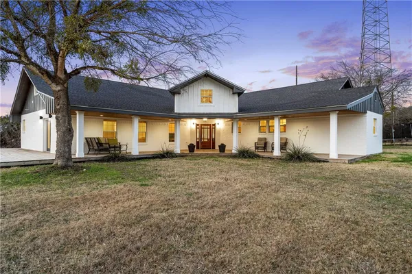 a view of a house with a back yard