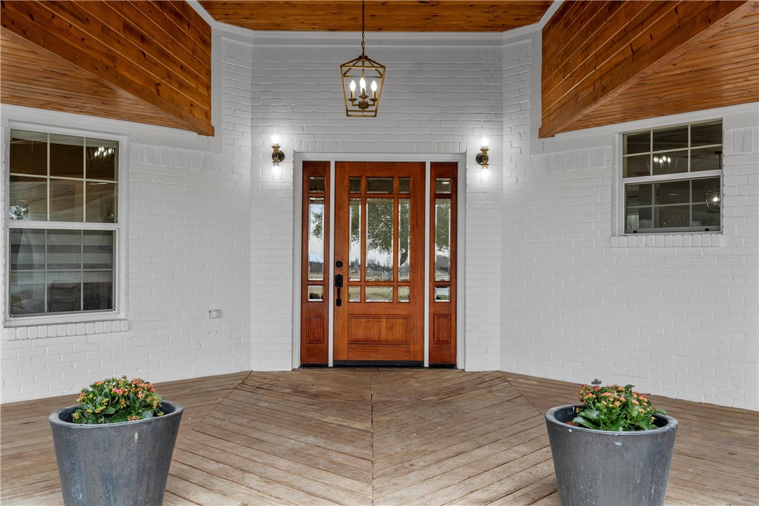15966 Old China Spring Road China Spring, TX 76633 - Photo 2 of 45 a front view of a house with potted plants
