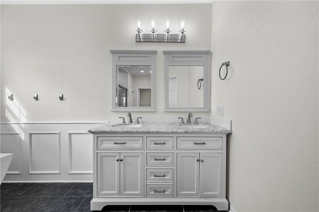 15966 Old China Spring Road China Spring, TX 76633 - Photo 28 of 45 a bathroom with a granite countertop sink and a mirror