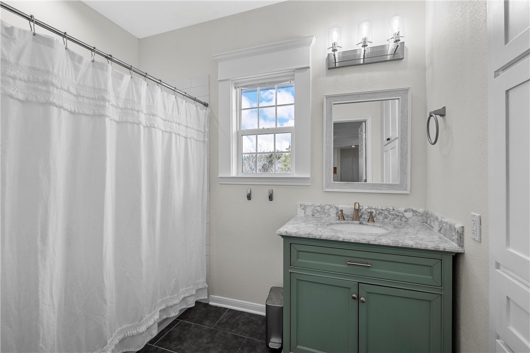 15966 Old China Spring Road China Spring, TX 76633 - Photo 32 of 45 a bathroom with a sink and a mirror