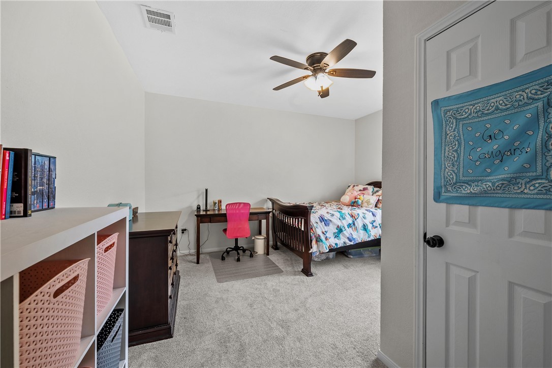 15966 Old China Spring Road China Spring, TX 76633 - Photo 36 of 45 a bedroom with furniture and a fan
