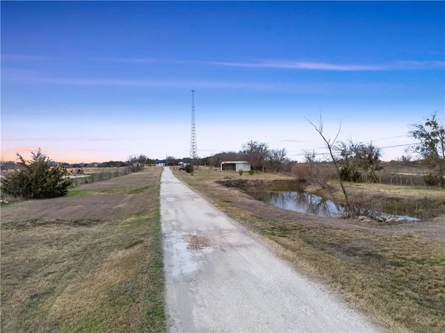 a view of a road with a yard